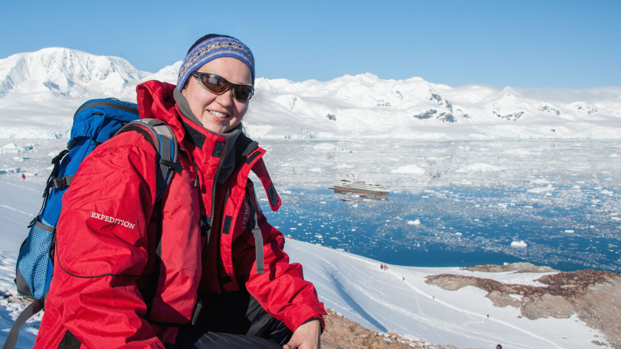 Lady posing for photo in Antarctica