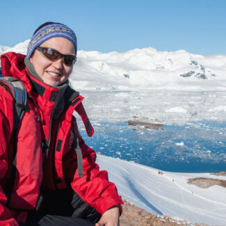 Lady posing for photo in Antarctica