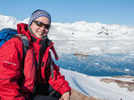 Lady posing for photo in Antarctica