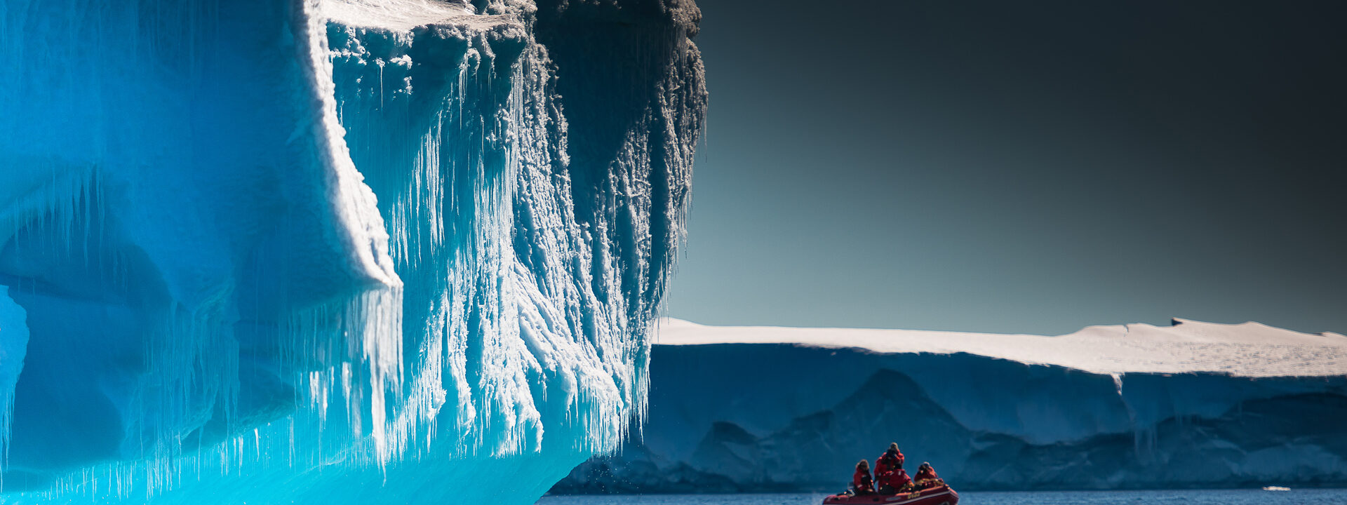 Small expedition tender by the iceberg