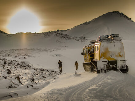 Researches walking in Antarctica